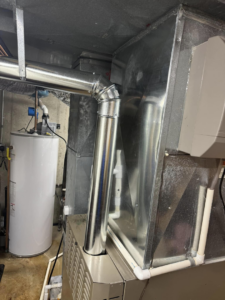 An indoor furnace and ductwork installation by Four Stages, a leading HVAC contractor in Chicago, IL.