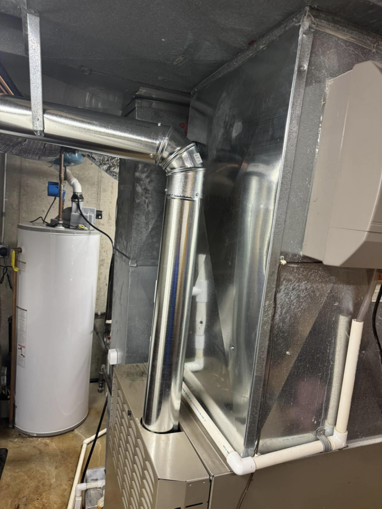 An indoor furnace and ductwork installation by Four Stages, a leading HVAC contractor in Chicago, IL.