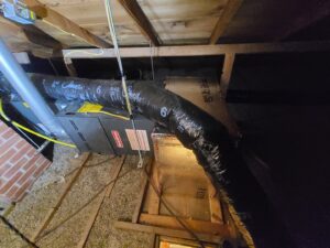 An indoor furnace and ductwork installation in a home by Rural Heating and Cooling Systems in Roundup, MT.