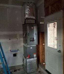 An indoor furnace and ductwork installation in a utility space, performed by Semenik Hvac/r in Spokane, WA.