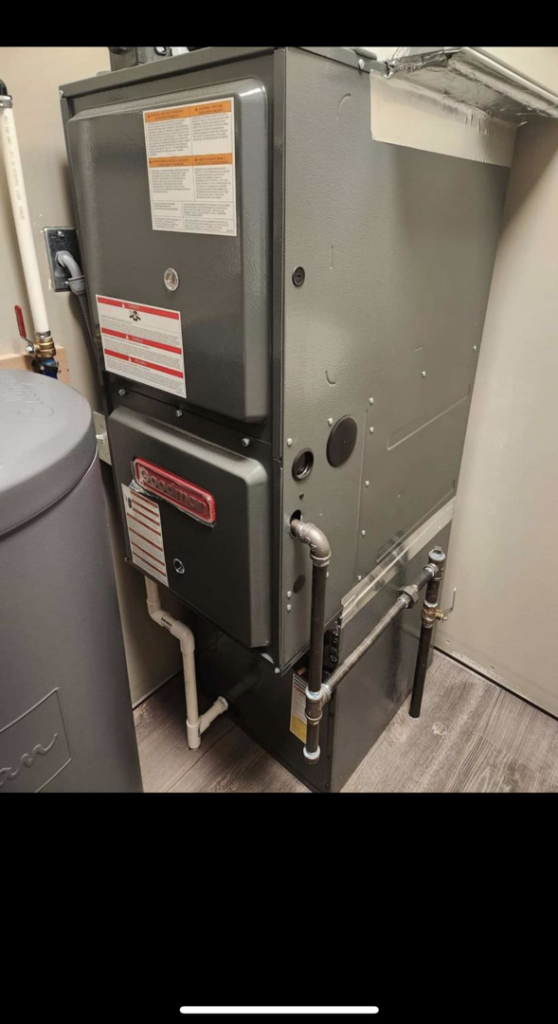 An indoor furnace and air handler unit installed by Affordable Heating & Cooling in Lafayette, IN.