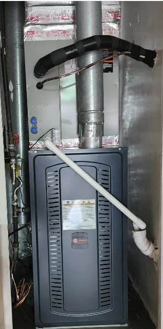 A newly installed indoor furnace and air handler unit by Air Factory Heating & Cooling Company in Oklahoma City, OK.
