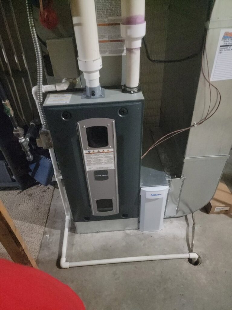 An American Standard indoor furnace with Aprilaire humidifier and ductwork, installed by Shrek Heating & Air Conditioning in Toledo, OH.