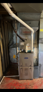 An indoor furnace and air handler unit installed by Legacy Heating & Air Conditioning LLC in Louisville, KY
