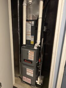 A newly installed indoor furnace unit in a utility closet by One Hour Heating & Air Conditioning of Lancaster, PA.