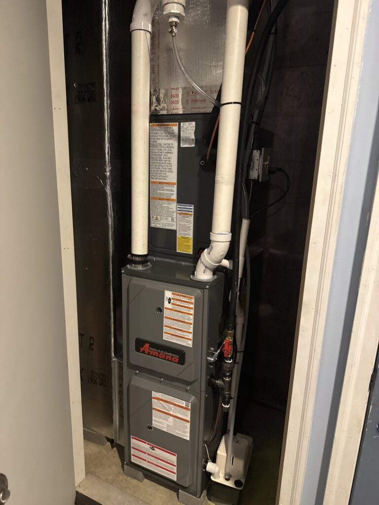A newly installed indoor furnace unit in a utility closet by One Hour Heating & Air Conditioning of Lancaster, PA.