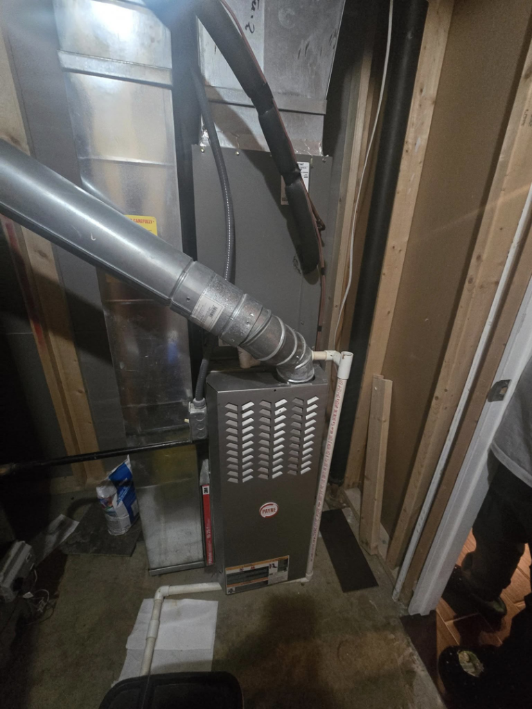 An indoor furnace and ductwork installation in a utility space by Temperature Comfort Heating and Cooling in Louisville, KY.