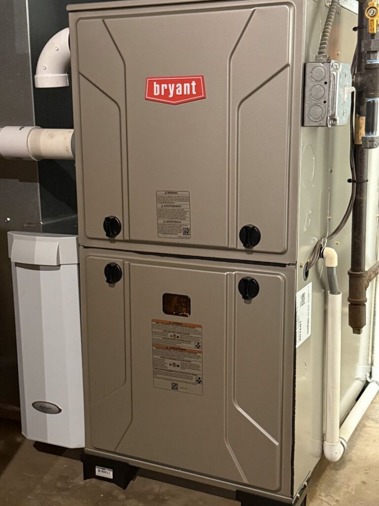 An indoor furnace and air handler unit installed by Kustom Heating & Cooling in Elgin, IL