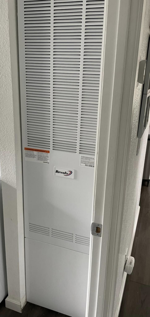 An indoor gas furnace unit installed in a utility closet by Torres HVAC LLC in Reno, NV.