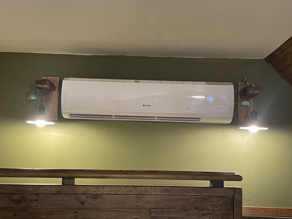 A modern Gree indoor mini-split HVAC unit professionally installed on a wall, offering efficient climate control from DeltaCool in Jonesboro, AR.