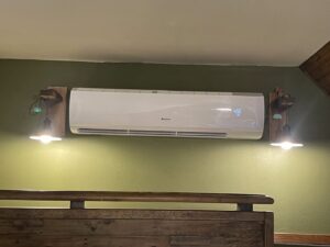 A modern Gree indoor mini-split HVAC unit professionally installed on a wall, offering efficient climate control from DeltaCool in Jonesboro, AR.