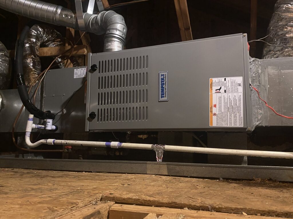An indoor HVAC air handler unit installed in an attic by Subzero Mechanical LLC Heating & Air in Concord, NC.