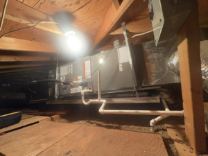 An indoor HVAC air handler unit installed in an attic by Weather Masters, Inc. in Mesa, AZ.