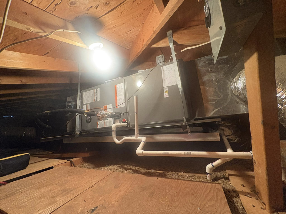 An indoor HVAC air handler unit installed in an attic by Weather Masters, Inc. in Mesa, AZ.