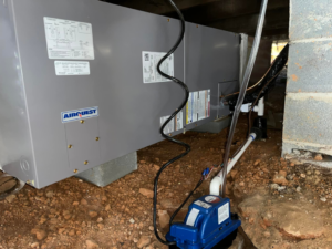 An indoor HVAC air handler unit installed in a crawl space by On-Target Heating & Air LLC in Rock Hill, SC.