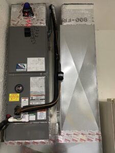 An indoor HVAC air handler and ductwork system installed by Surfside Heating & Cooling in Cape Coral, FL.