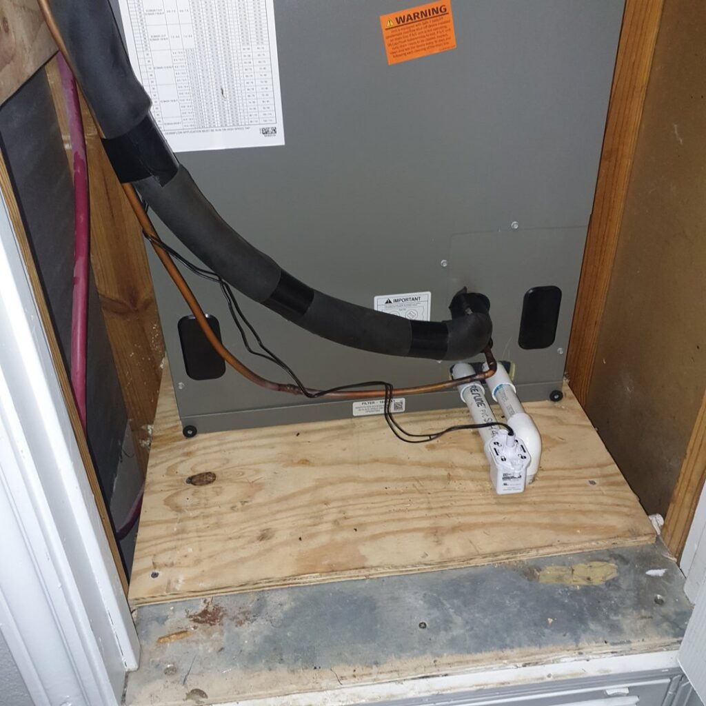 An indoor HVAC air handler unit installed in a residential closet by Home Shield Heating and Air in Shreveport, LA.
