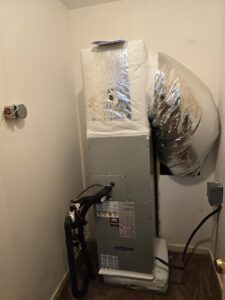 An indoor HVAC air handler unit with ductwork installed by M&B Heating and Air in Charleston, SC.