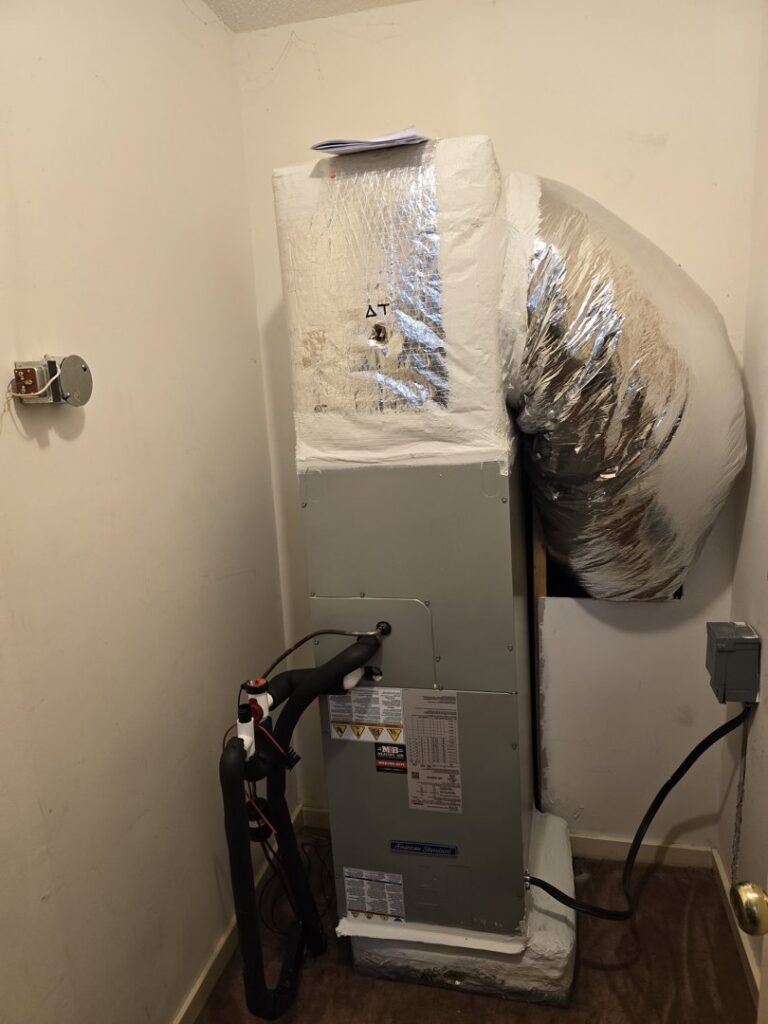 An indoor HVAC air handler unit with ductwork installed by M&B Heating and Air in Charleston, SC.