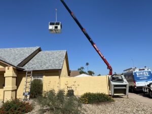 An indoor HVAC air handler unit installed in a garage by Schiller Heating & Cooling in Tempe, AZ.