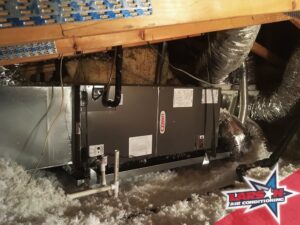 An indoor HVAC air handler unit installed in an attic by Larson Air Conditioning in Scottsdale, AZ