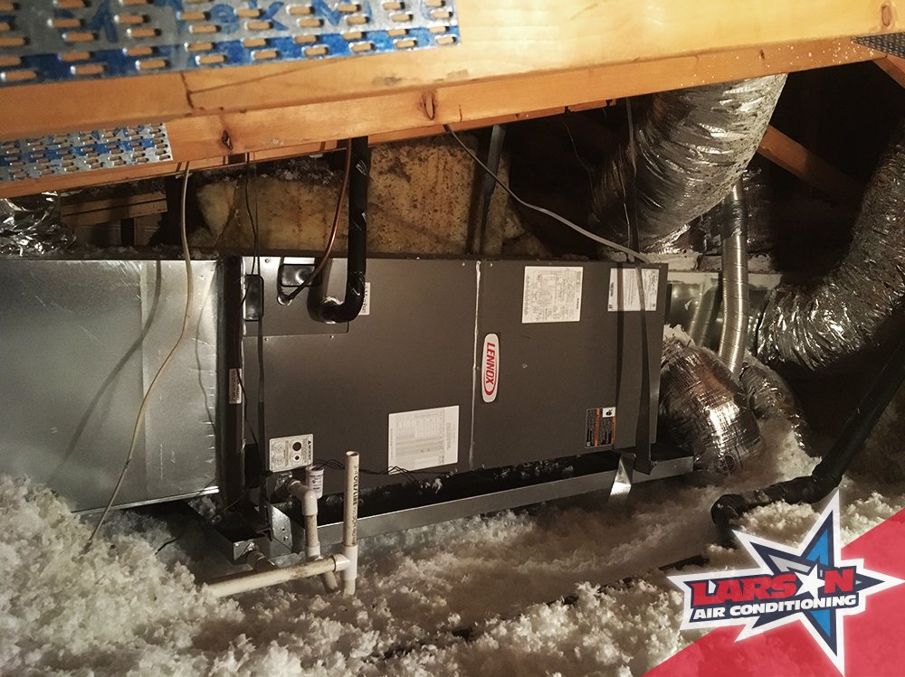An indoor HVAC air handler unit installed in an attic by Larson Air Conditioning in Scottsdale, AZ