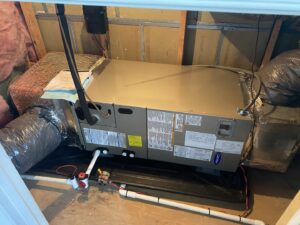 An indoor HVAC air handler unit installed in an attic by Residential Express Heating & Air in Sterling, VA.
