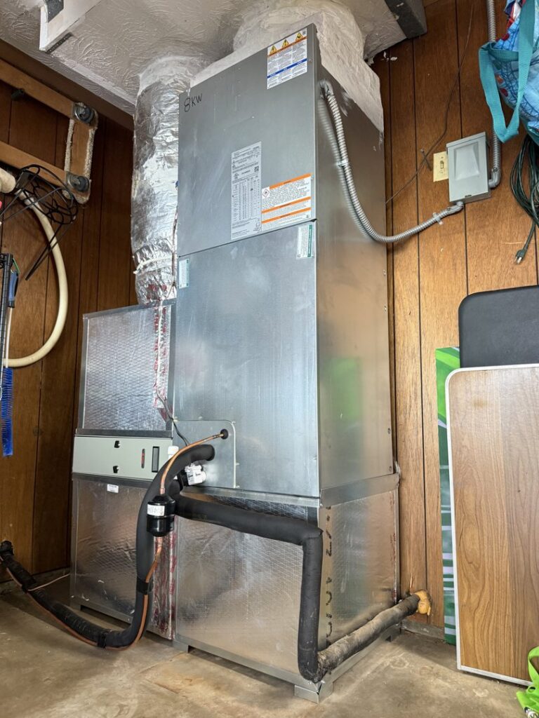 An indoor HVAC air handler unit and ductwork installed by Willman Air in Jacksonville, FL.