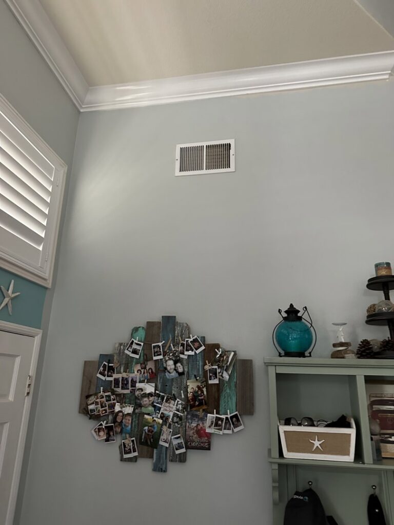 An indoor HVAC air vent or register on a wall, installed by Genesis - Heating and Air Conditioning Specialist in SUNNYSIDE, NY