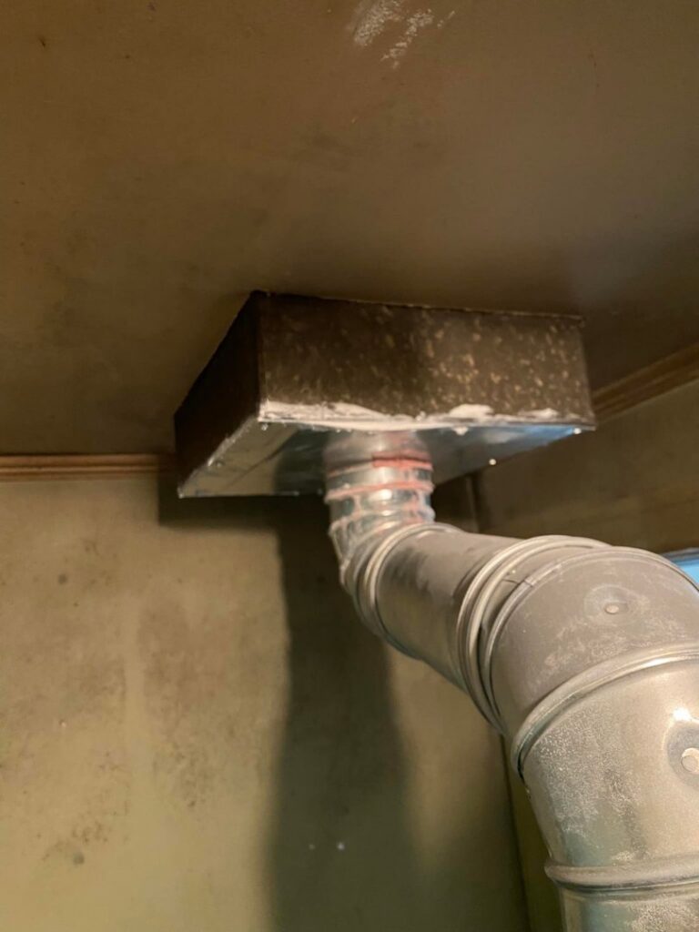 Indoor metal HVAC ductwork connected to a ceiling vent, installed by All American Heating Air & More LLC in Wilson, NC.