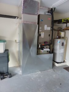 An indoor HVAC furnace and air handler unit with new ductwork installed by Air Zero in Largo, FL