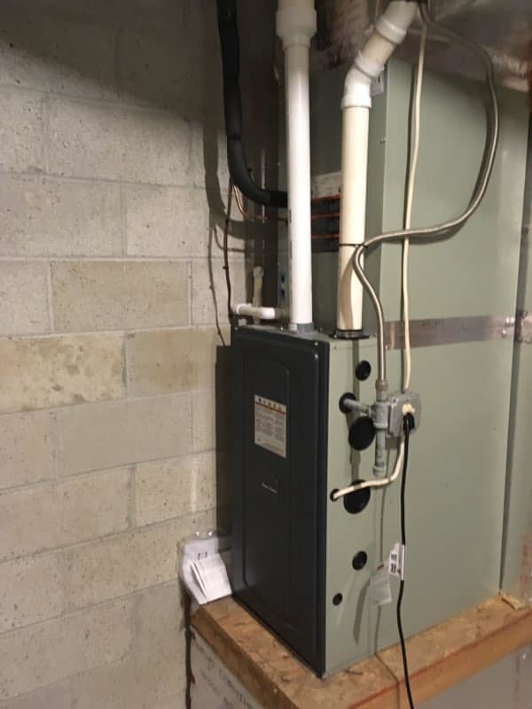 An indoor HVAC furnace and ductwork installation in a utility room by James HVAC LLC in Georgetown, DE.