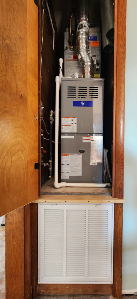 An indoor HVAC furnace and air handler unit installed in a utility closet by Xtreme Heating & Cooling in Tulsa, OK