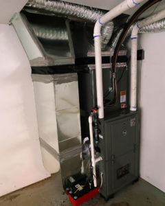 A newly installed indoor HVAC furnace and ductwork system by Vico&Son HVAC Services and Sheet Metal LLC in Beltsville, MD.
