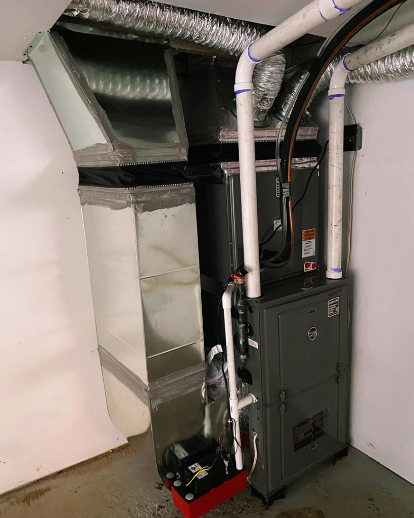A newly installed indoor HVAC furnace and ductwork system by Vico&Son HVAC Services and Sheet Metal LLC in Beltsville, MD.