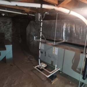 An indoor HVAC furnace and ductwork installation in a basement by Dynamic Heating, Cooling, Refrigeration & Roofing in El Paso, TX.