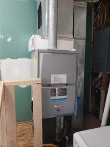 An indoor HVAC furnace unit with connected ductwork installed by Kopetsky HVAC in Indianapolis, IN.