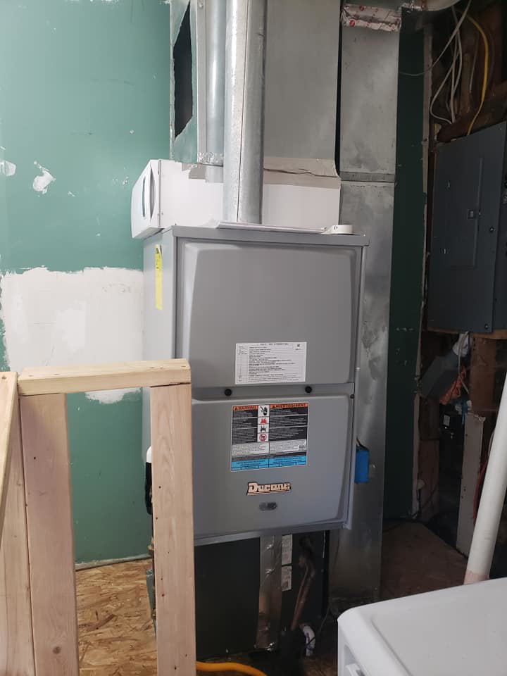 An indoor HVAC furnace unit with connected ductwork installed by Kopetsky HVAC in Indianapolis, IN.