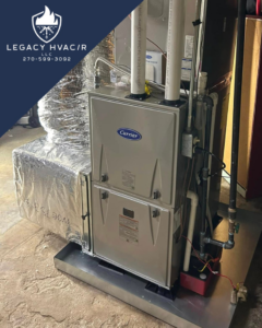 An indoor Carrier HVAC furnace and air handler unit with ductwork installed by Legacy Hvac/r in Libertyville, IL.