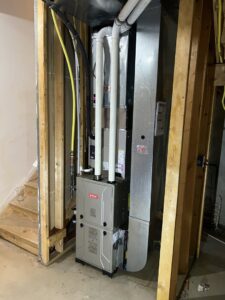 An indoor HVAC furnace and air handler unit installation by Synergy3, an HVAC contractor in Philadelphia, PA.