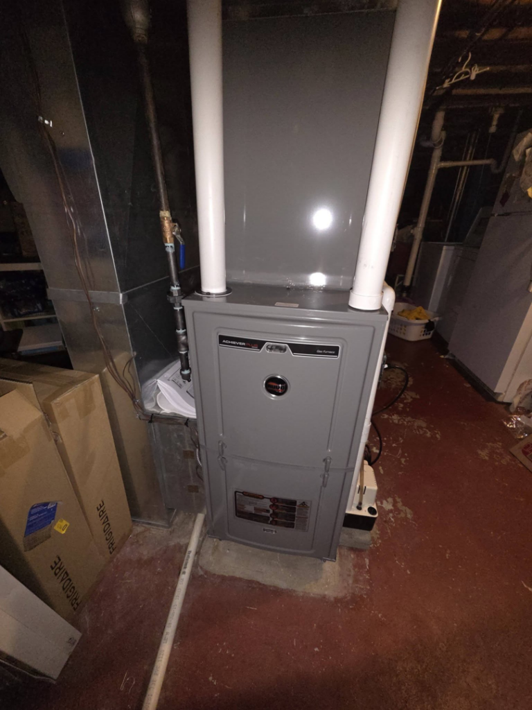 An indoor HVAC furnace unit installed in a basement by DWE Home Services in Cincinnati, OH.