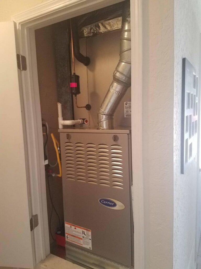 An indoor Carrier HVAC furnace unit installed by Anderson Refrigeration, Inc. in Poplar Grove, IL.