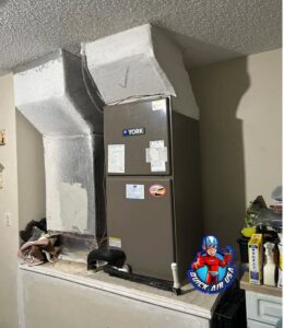 An indoor HVAC furnace unit with connected ductwork, installed by QUICK AIR USA in Orlando, FL.