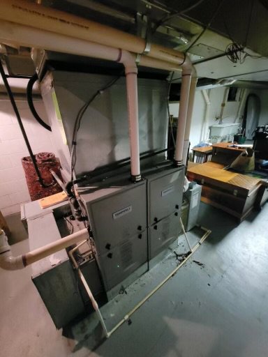 An indoor HVAC system with ductwork and piping, installed or serviced by Carpenter Mechanical in Columbus, OH.