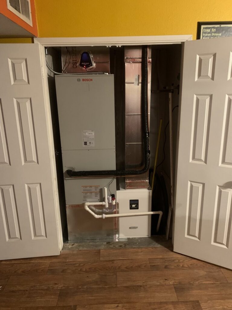 An indoor HVAC system, including a furnace, installed in a closet by Lipovic Heating & Cooling in Mesa, AZ.