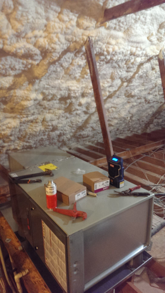 An indoor HVAC unit being installed or serviced in an attic by Moss Heating and Air in Greenville, SC