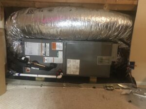 An indoor HVAC unit with insulated ductwork installed in a residential space by Gouker's Best Air in Franklin, TN.