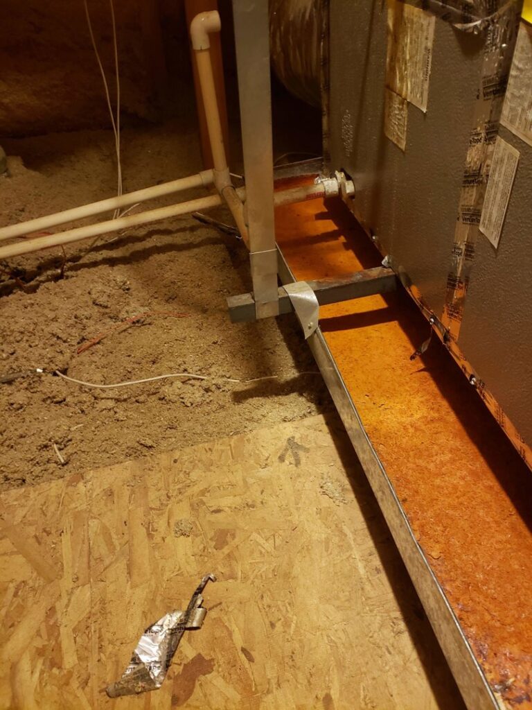 An indoor HVAC unit with associated ductwork and piping in an attic, installed by Vertex Heating & Cooling in Buckeye, AZ