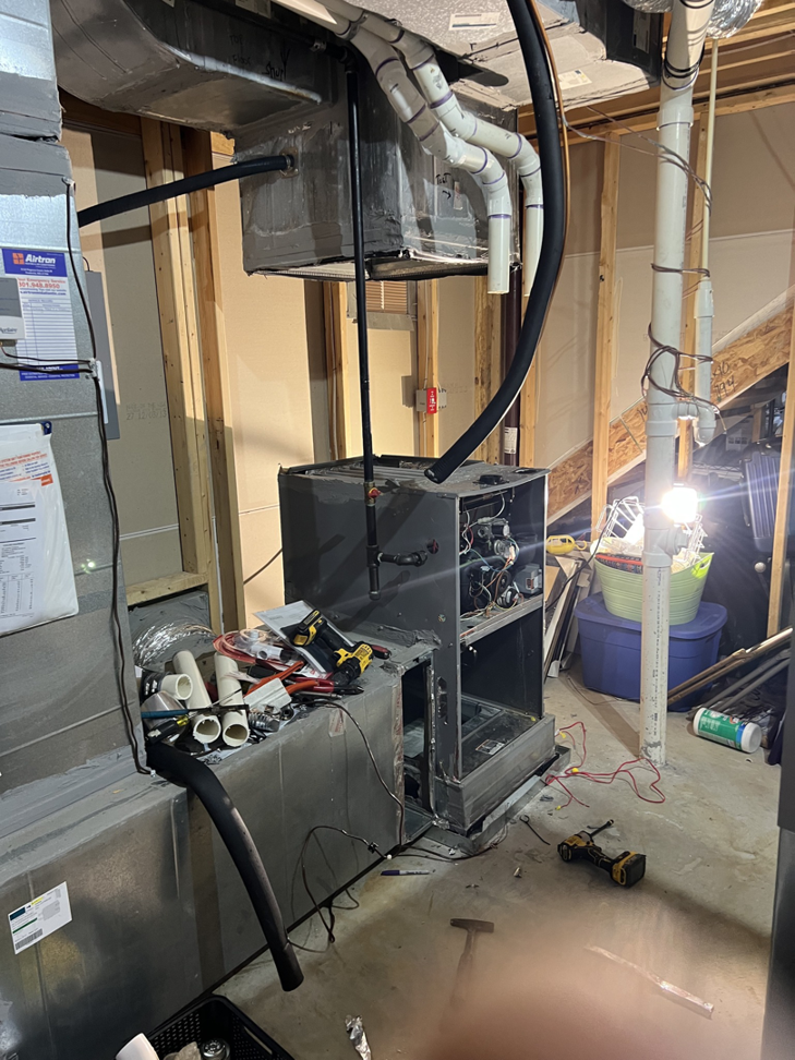 An indoor HVAC unit undergoing installation or repair by Rescue Heating and Air Conditioning in Manassas, VA