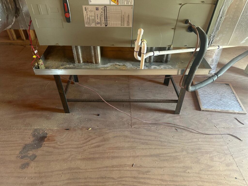 An indoor HVAC unit on a stand with a new air filter ready for installation, provided by Air Casablanca Heating & Cooling in Myrtle Beach, SC.